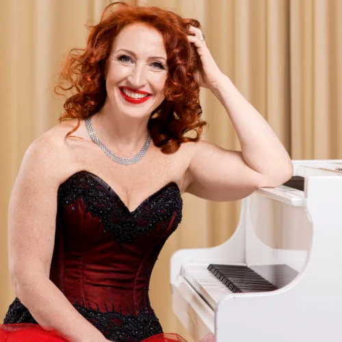 Tessa Virta at the white piano.