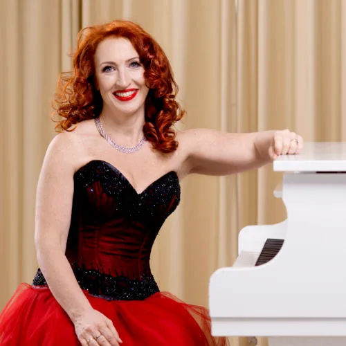 Tessa Virta at the white piano.